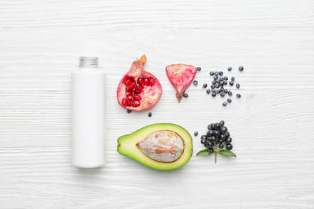 Composition with bottle of cosmetic product on light wooden backgroundの写真素材