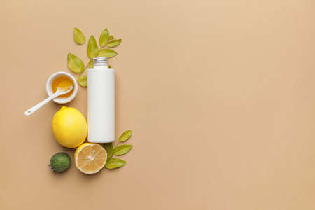 Composition with bottle of natural cosmetic product on color background