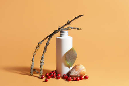 Composition with bottle of cosmetic product on color background