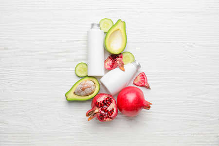 Composition with natural cosmetic products on light wooden background