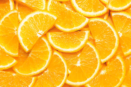 Pieces of fresh oranges as background