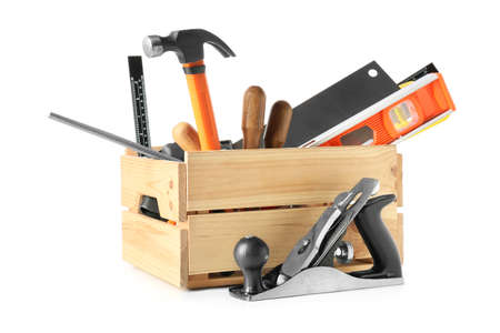 Box with different carpenter's tools on white background