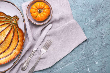 Beautiful table setting for Thanksgiving Day celebration on color backgroundの写真素材