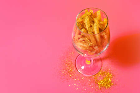 Creative composition with tasty french fries on color backgroundの写真素材