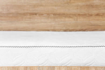 Modern orthopedic mattress on bed, closeupの写真素材