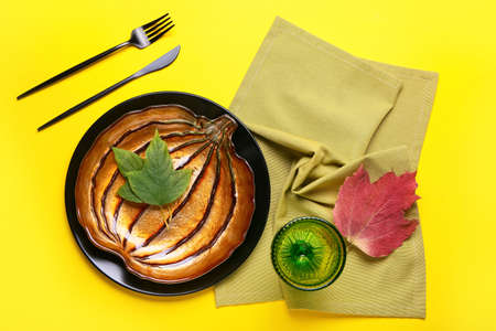 Beautiful table setting for Thanksgiving Day celebration on color backgroundの写真素材