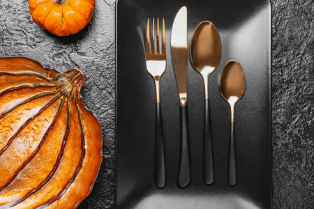 Beautiful table setting for Thanksgiving Day celebration on dark backgroundの写真素材