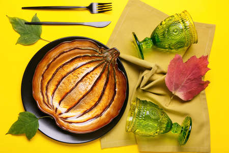 Beautiful table setting for Thanksgiving Day celebration on color backgroundの写真素材