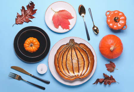 Beautiful table setting for Thanksgiving Day celebration on color backgroundの写真素材
