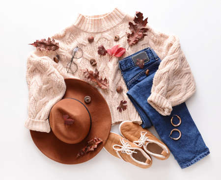Autumn composition with stylish clothes on white backgroundの写真素材