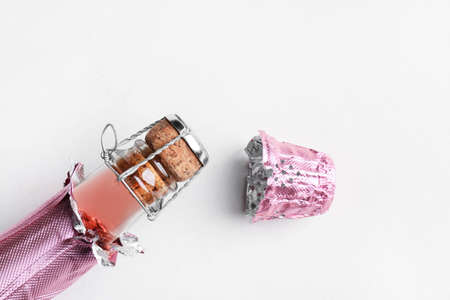 Bottle of champagne with cork on white background, closeupの写真素材