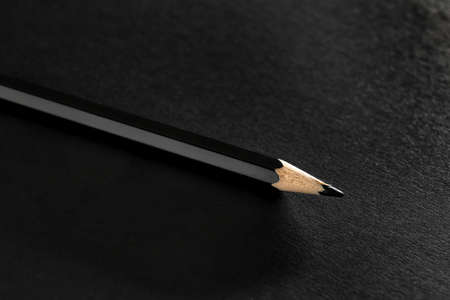 Black pencil on dark background, closeupの写真素材