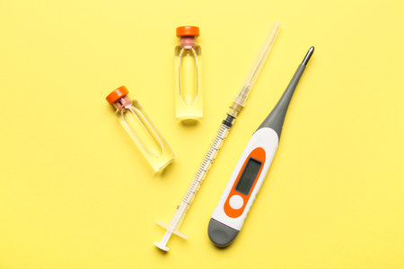 Thermometer and remedy on color background