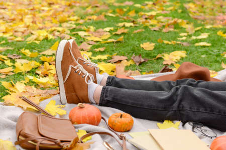 Woman resting in autumn parkの写真素材