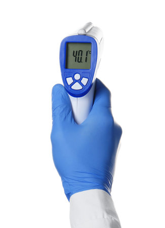 Hand of doctor with infrared thermometer on white background