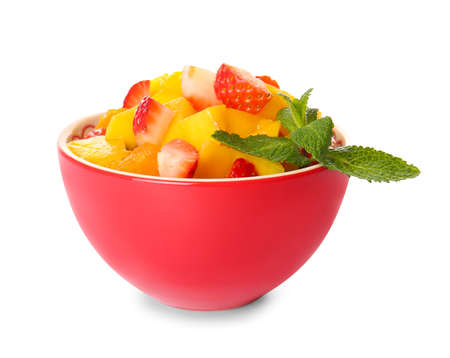 Bowl with tropical fruit salad on white backgroundの写真素材