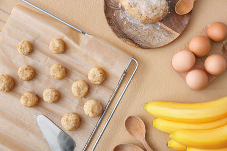 Composition with uncooked banana cookies on color backgroundの写真素材