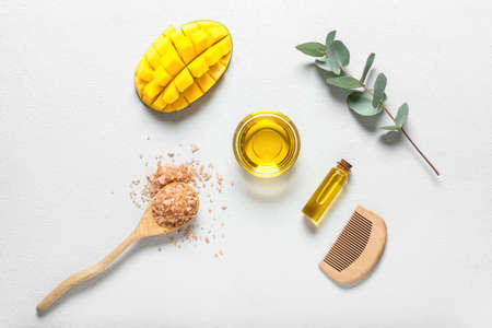 Composition with mango essential oil on white backgroundの写真素材