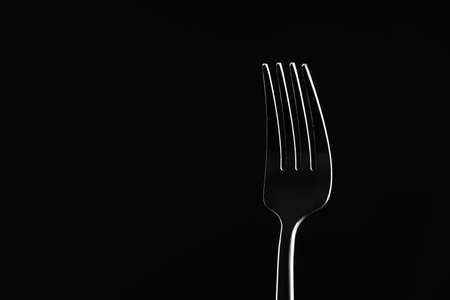 Stylish fork on dark backgroundの写真素材
