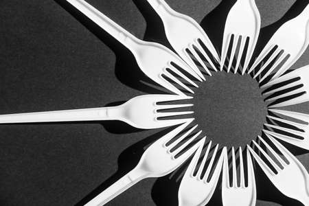 Plastic fork on dark background