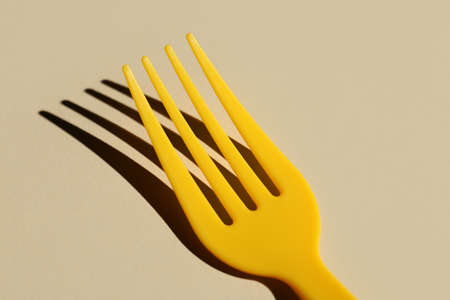 Plastic fork on color backgroundの写真素材