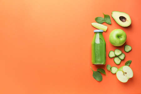 Composition with bottle of healthy green smoothie and ingredients on color backgroundの写真素材