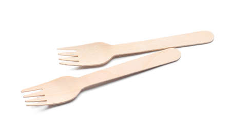 Wooden forks on white background