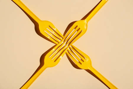 Plastic forks on color backgroundの写真素材