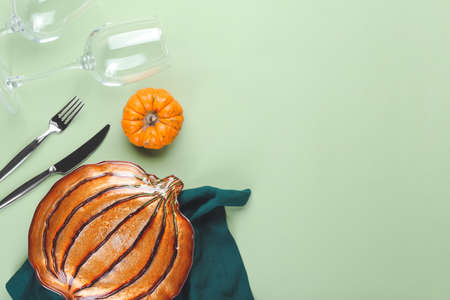 Beautiful table setting for Thanksgiving Day celebration on color backgroundの写真素材