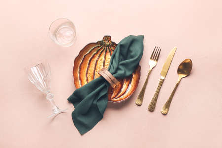 Beautiful table setting for Thanksgiving Day celebration on color background