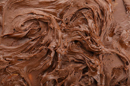 Sweet melted chocolate as background, closeupの写真素材