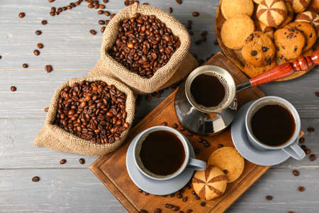 Composition with cups of hot coffee on dark wooden backgroundの写真素材