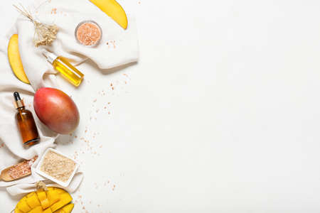 Composition with mango essential oil on white backgroundの写真素材