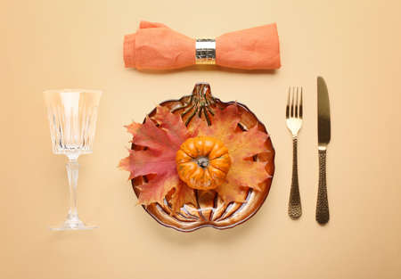 Beautiful table setting for Thanksgiving Day celebration on color backgroundの写真素材