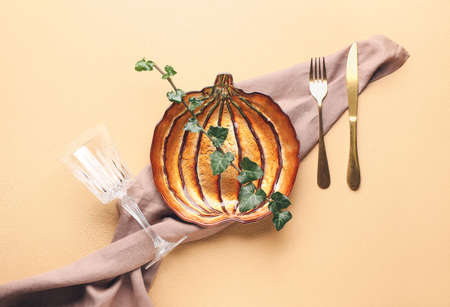 Beautiful table setting for Thanksgiving Day celebration on color backgroundの写真素材