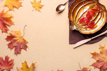 Beautiful table setting for Thanksgiving Day celebration on color backgroundの写真素材