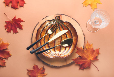 Beautiful table setting for Thanksgiving Day celebration on color backgroundの写真素材