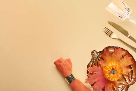 Beautiful table setting for Thanksgiving Day celebration on color backgroundの写真素材