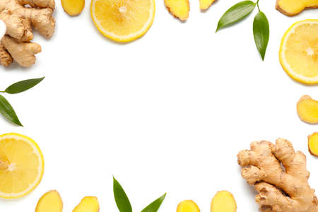 Frame made of fresh ginger and lemon on white backgroundの写真素材