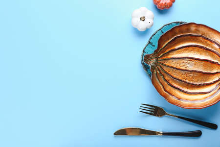 Beautiful table setting for Thanksgiving Day celebration on color backgroundの写真素材