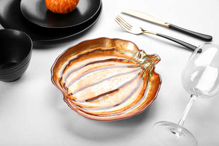 Beautiful table setting for Thanksgiving Day celebration on light backgroundの写真素材