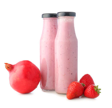 Bottles of tasty berry smoothie on color backgroundの写真素材