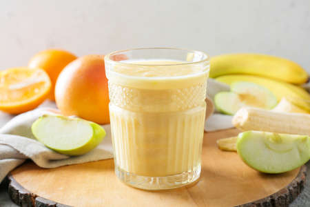 Glass of tasty fruit smoothie, closeupの写真素材