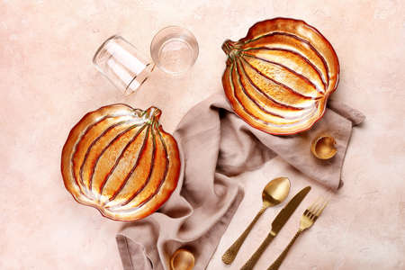 Beautiful table setting for Thanksgiving Day celebration on color backgroundの写真素材