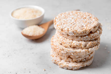 Stack of rice crackers on light backgroundの写真素材