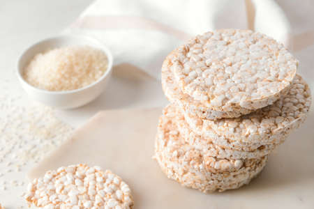 Stack of rice crackers on light backgroundの写真素材