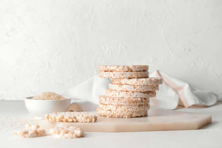 Stack of rice crackers on light backgroundの写真素材