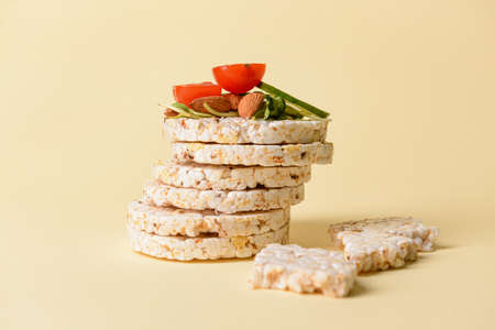 Stack of rice crackers on color backgroundの写真素材
