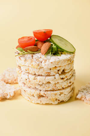 Stack of rice crackers on color backgroundの写真素材