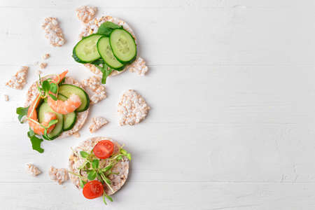 Composition with rice crackers on white wooden backgroundの写真素材